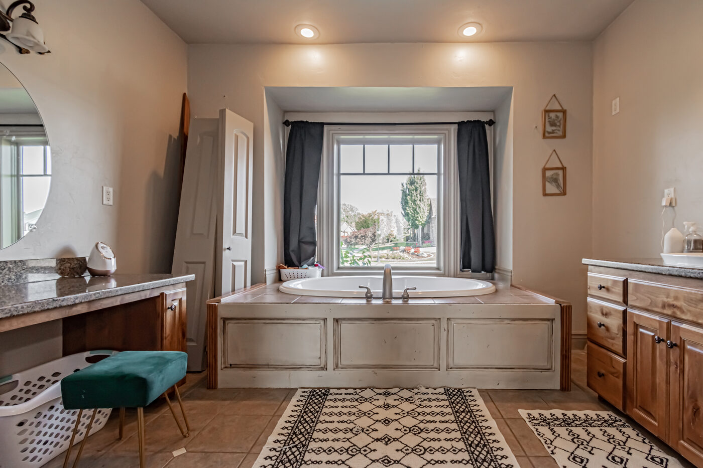 Primary bathroom with soaking tub in arched niche